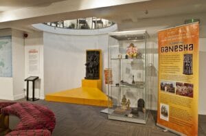 An exhibition display of a statue of the Hindu god Ganesha.