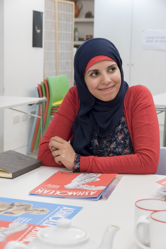 ITP fellow Heba Khairy sits at a table.