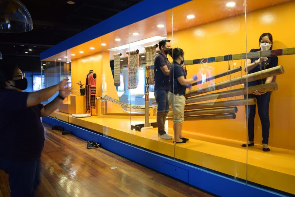 Staff working in the gallery at the National Museum of Anthropology, Manila, Philippines