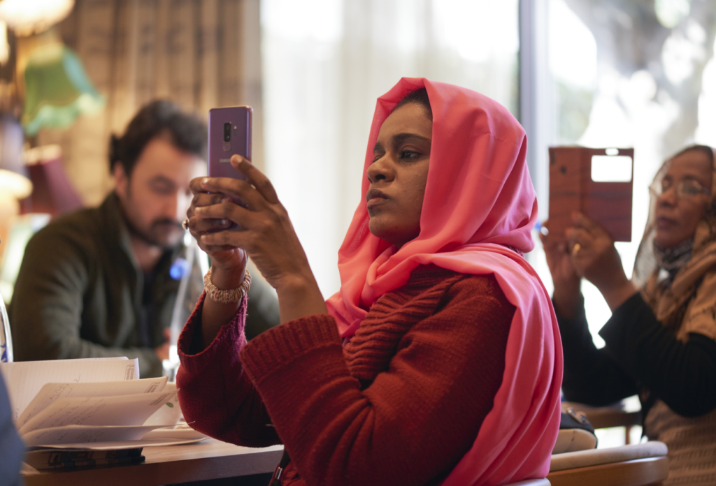 ITP fellow Nosiba Ali takes a photo with her phone