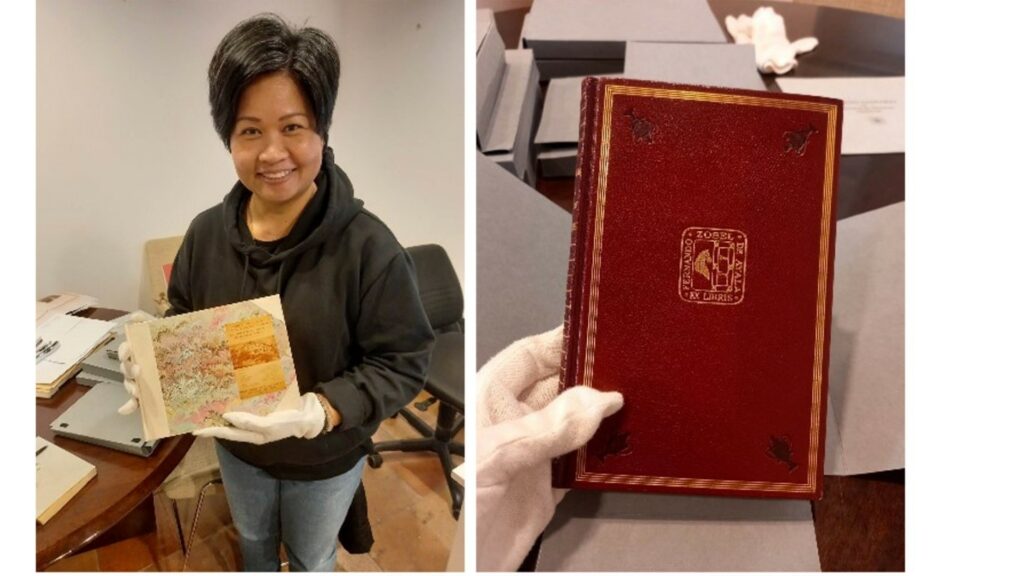Aprille holding sketchbooks of Fernando Zobel