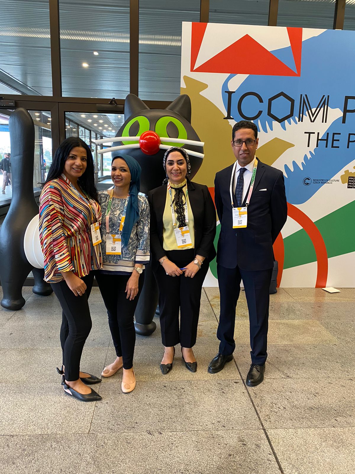 Nevine standing with ITP colleagues at ICOM conference