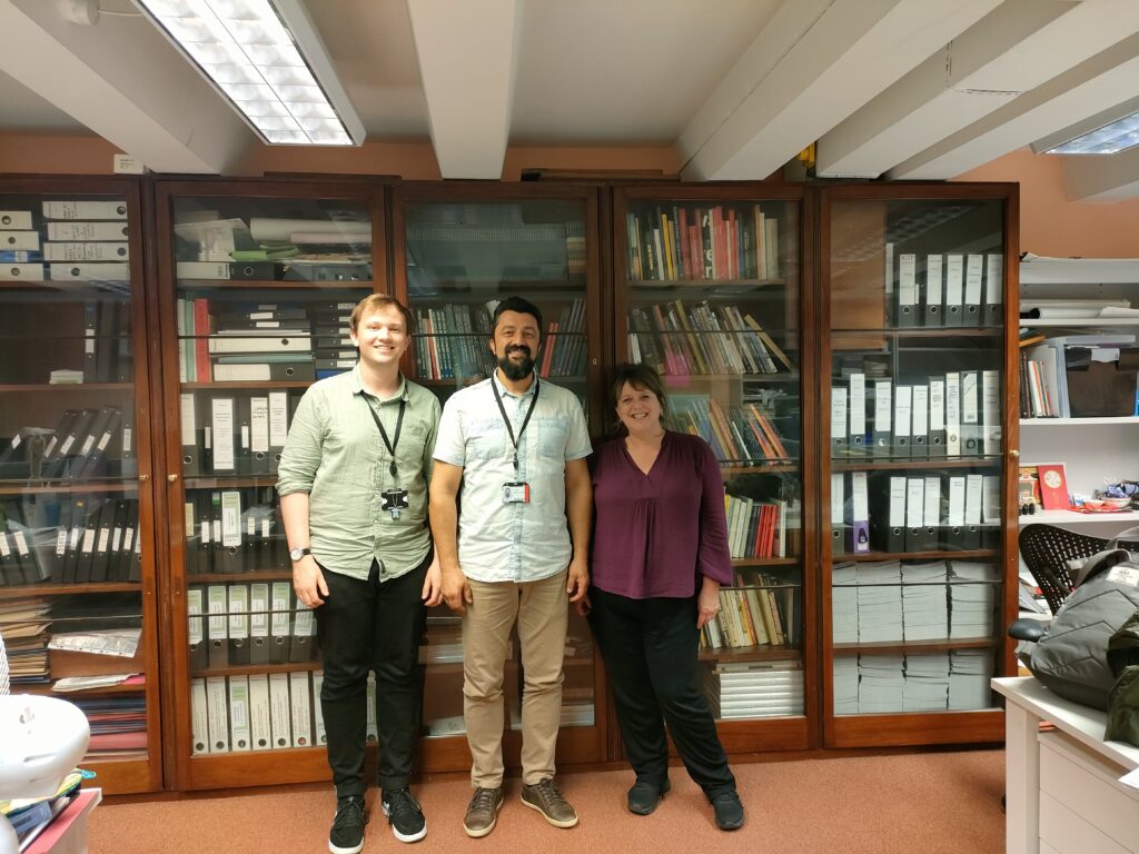 Ciprian standing for a photo with Claire Messenger, ITP Manager, and George Peckham, ITP Coordinator