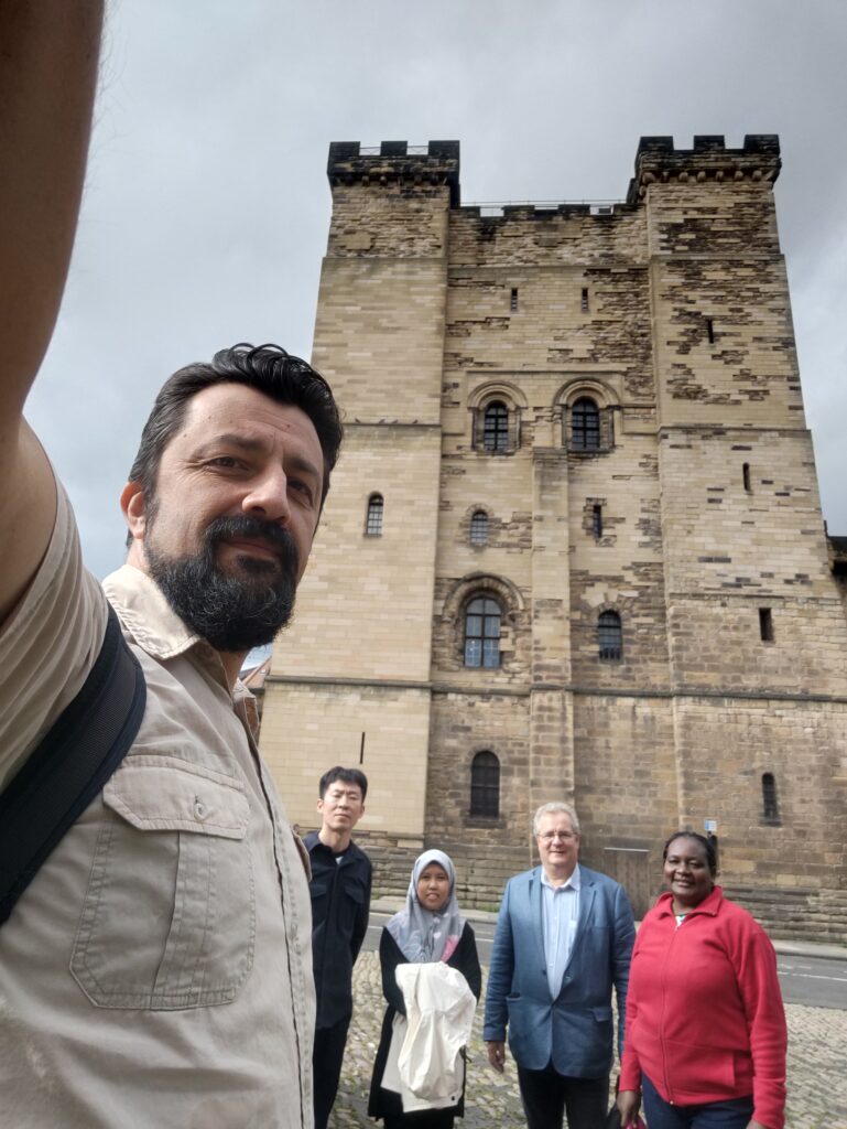 Ciprian taking a selfie with Gao Rui, Malissa, Bill Griffiths and Rodah in Newcastle.