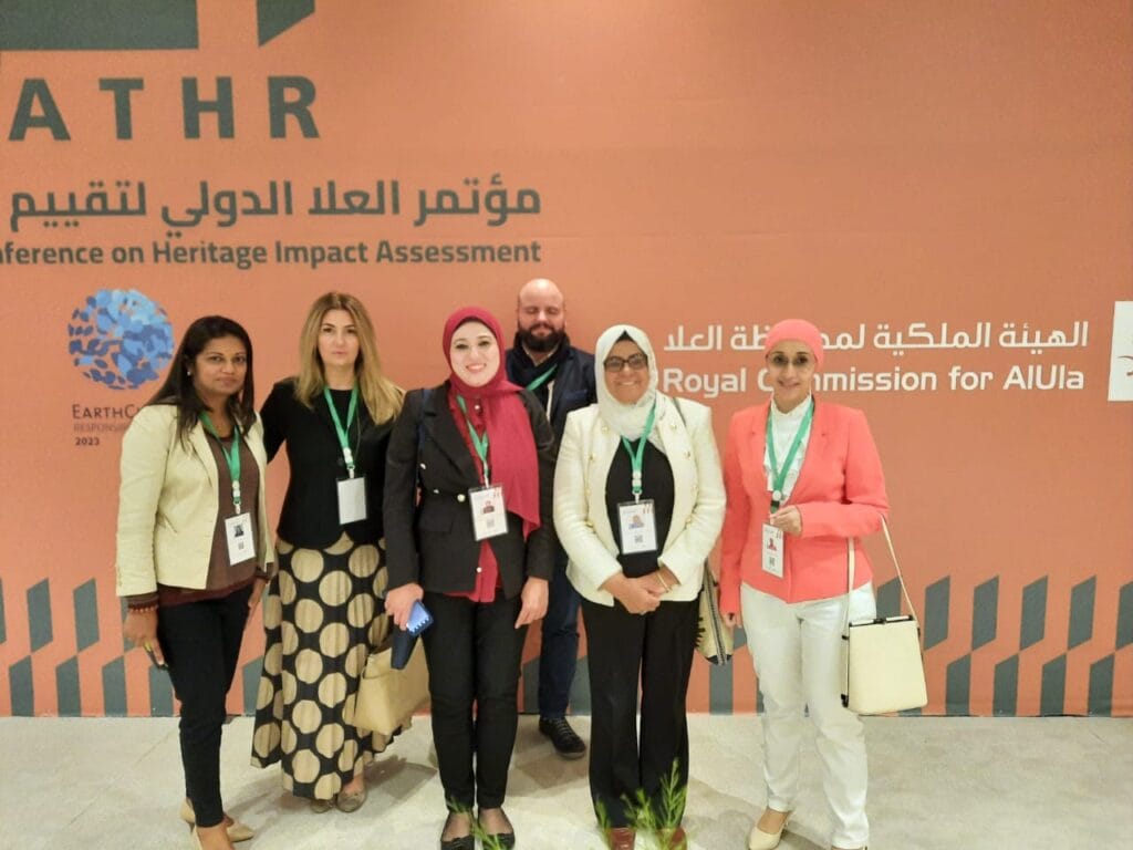 Shreen photographed with other participants of the ALULA International Conference.