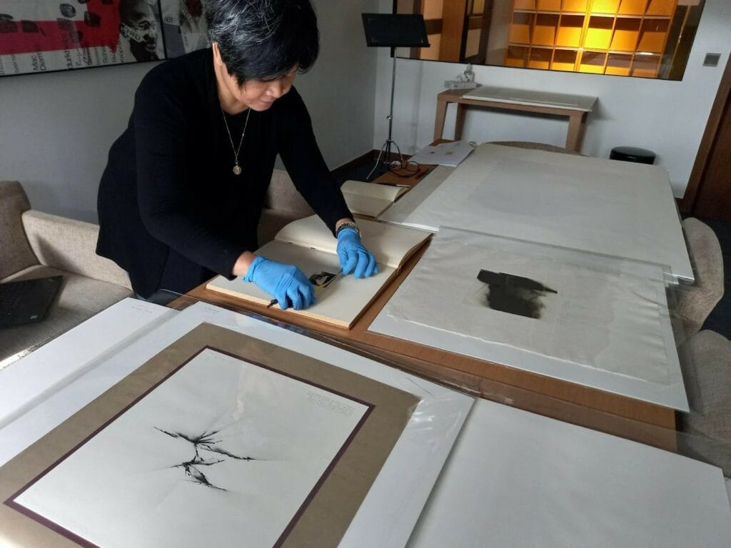 ITP fellow Aprille Tijam looking at objects using her research grant.
