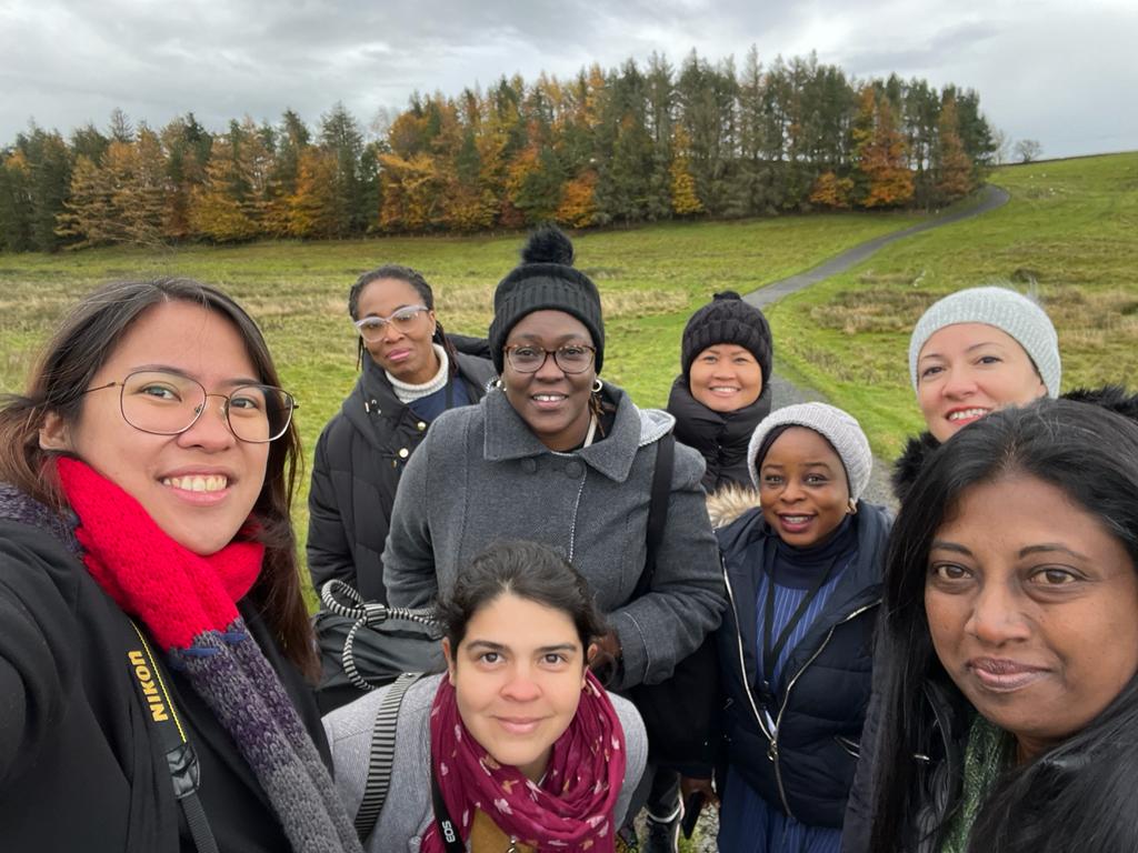 Yanoa taking a selfie with other ITP fellows at Hadrian's Wall.