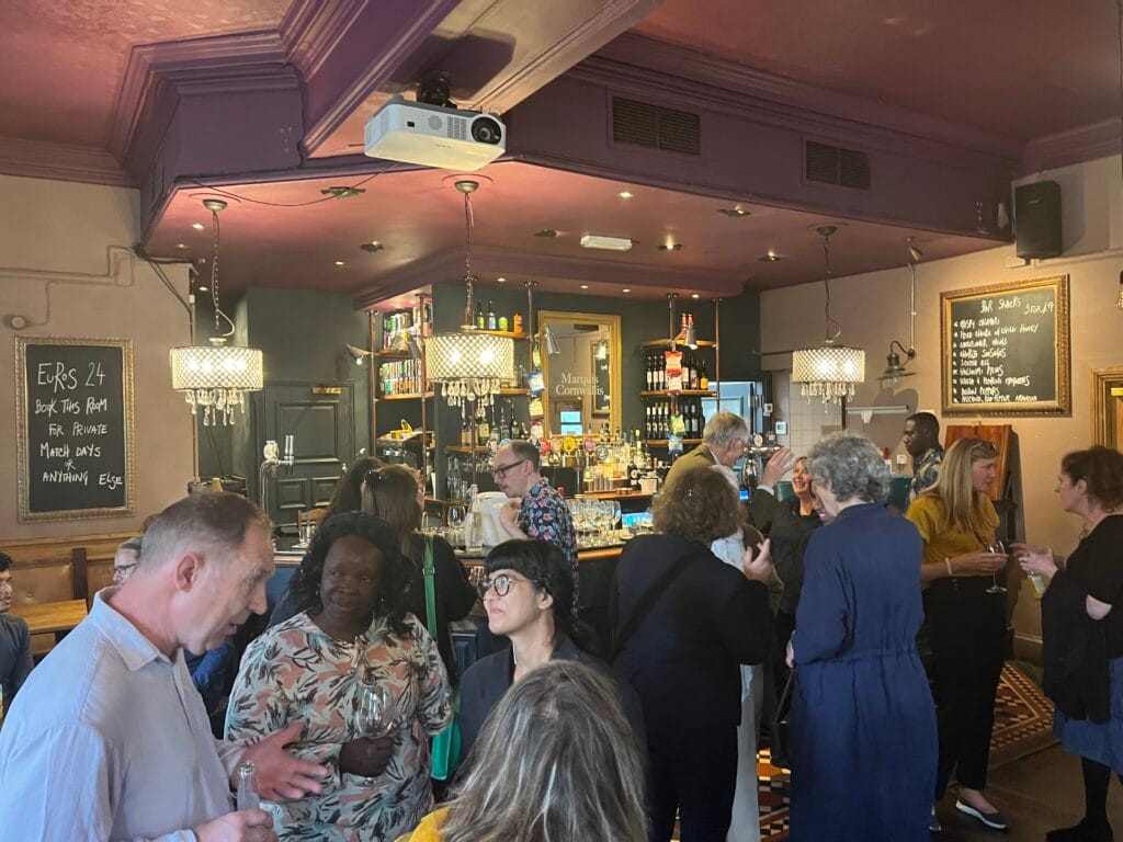 Photograph of a busy pub interior.