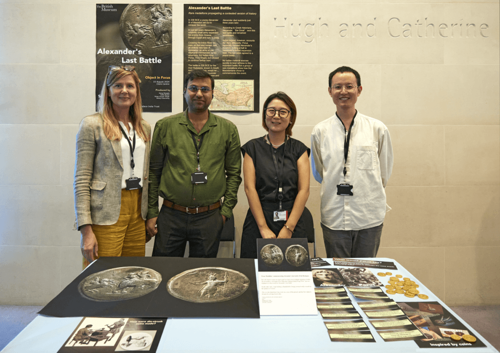 Asia and Money and Medals object in focus group standing with their project