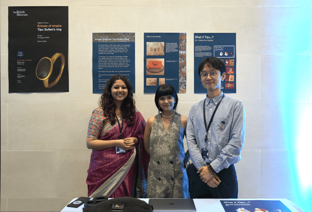 Shubhasree, Pinky and Zecheng stand with their object in focus display