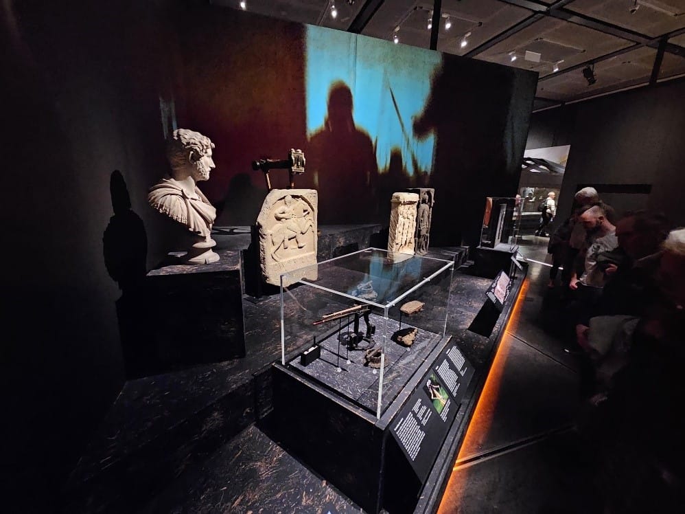 Photograph of stone objects on display in the Legion exhibition