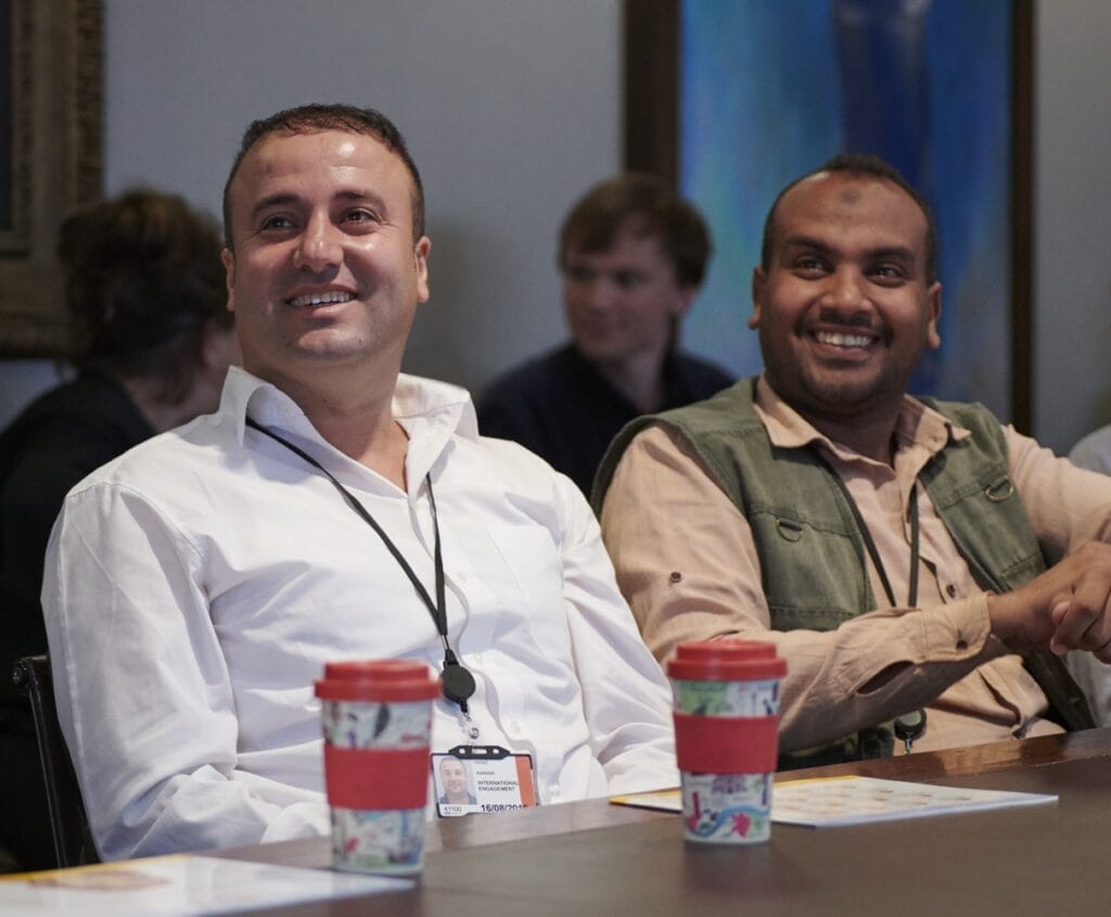 Photograph of two men smiling,