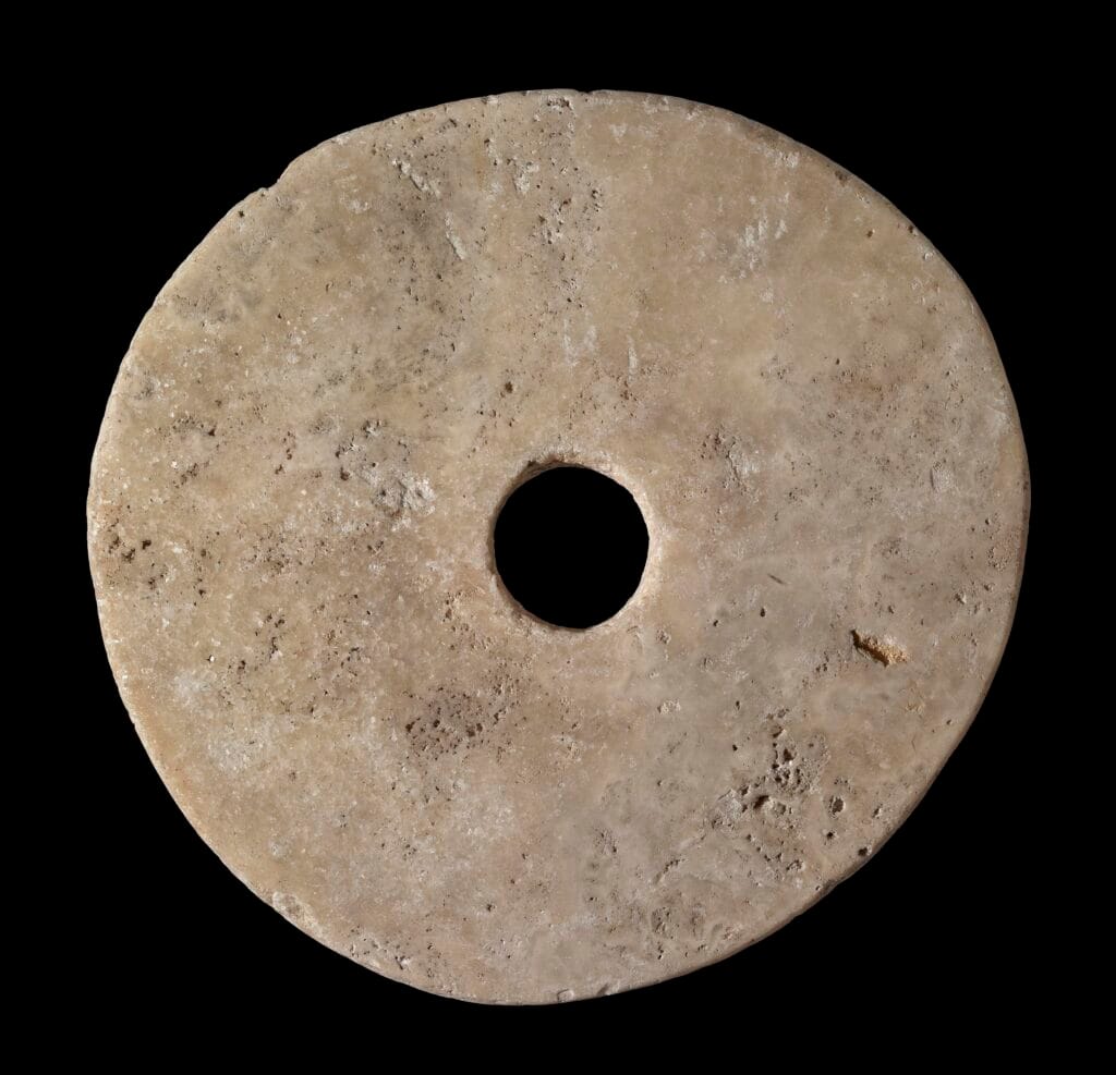 stone currency: heavy circular piece of stone with a central hole.