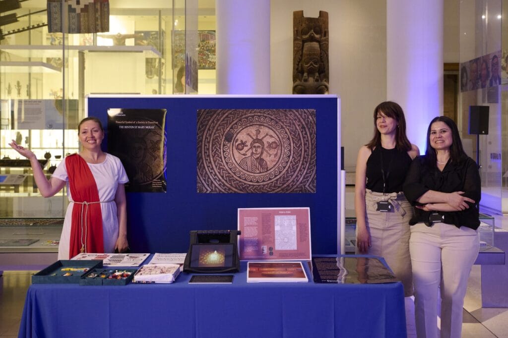 Olena Shevchenko, Demetra Ignatiou and Perihan Donertas standing with their Object in focus display