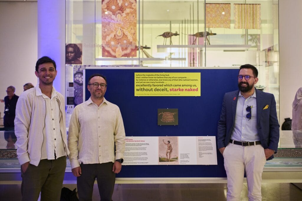 Daniel Lira, Fernando Astudillo and Julian Roa Triana standing with their object in focus display. 